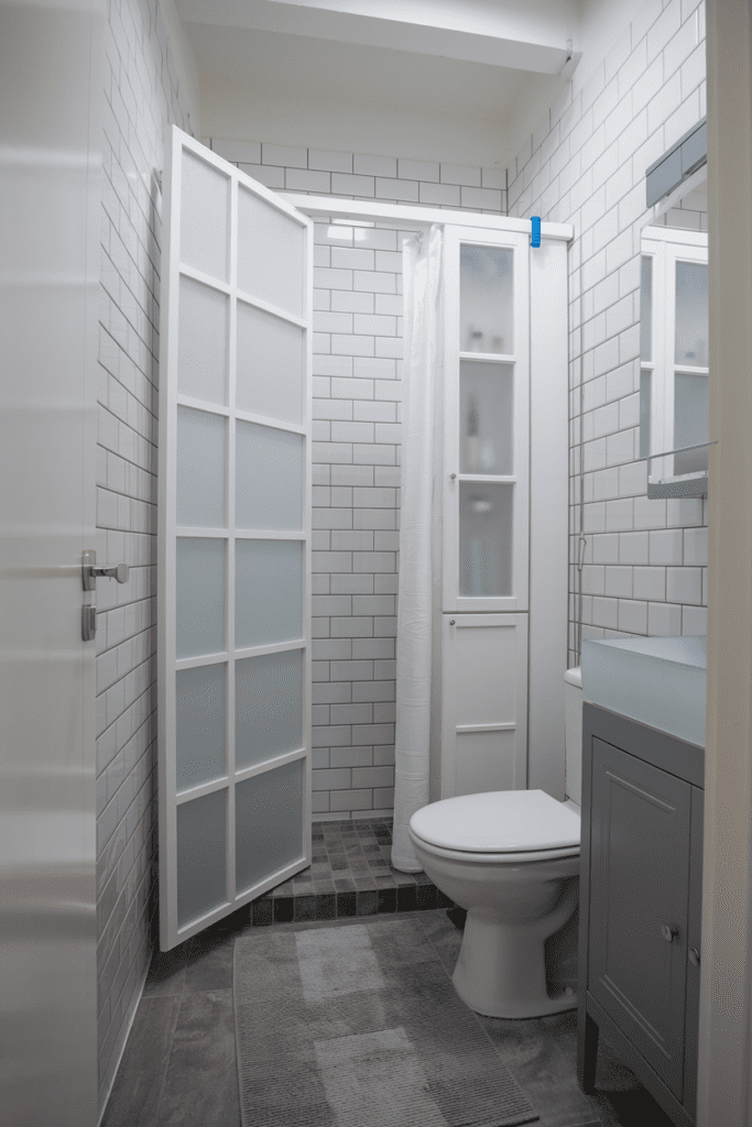 Add a Pocket Door for Space-Saving Access Small Bathroom Interior Ideas