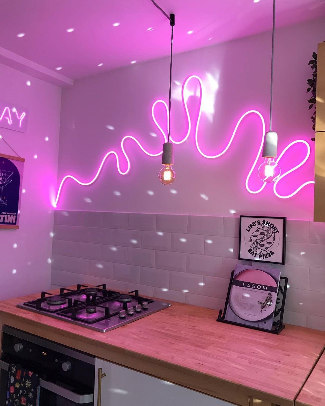 Stunning Pink Kitchens That Will Blow Your Mind in 2025 34 Neon Glow: Futuristic Pink Ambiance