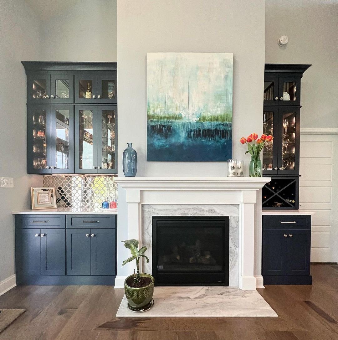 Bold Contrast with Navy Accents And Tile Fireplace Surround