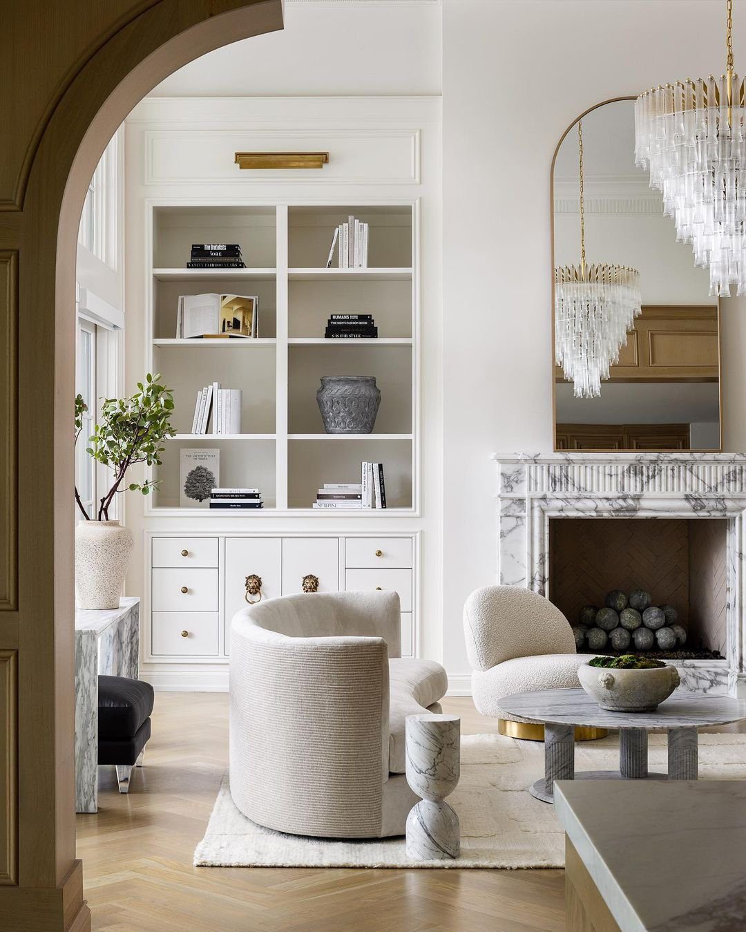 Classic Sophistication with Marble Accents Around Fireplace