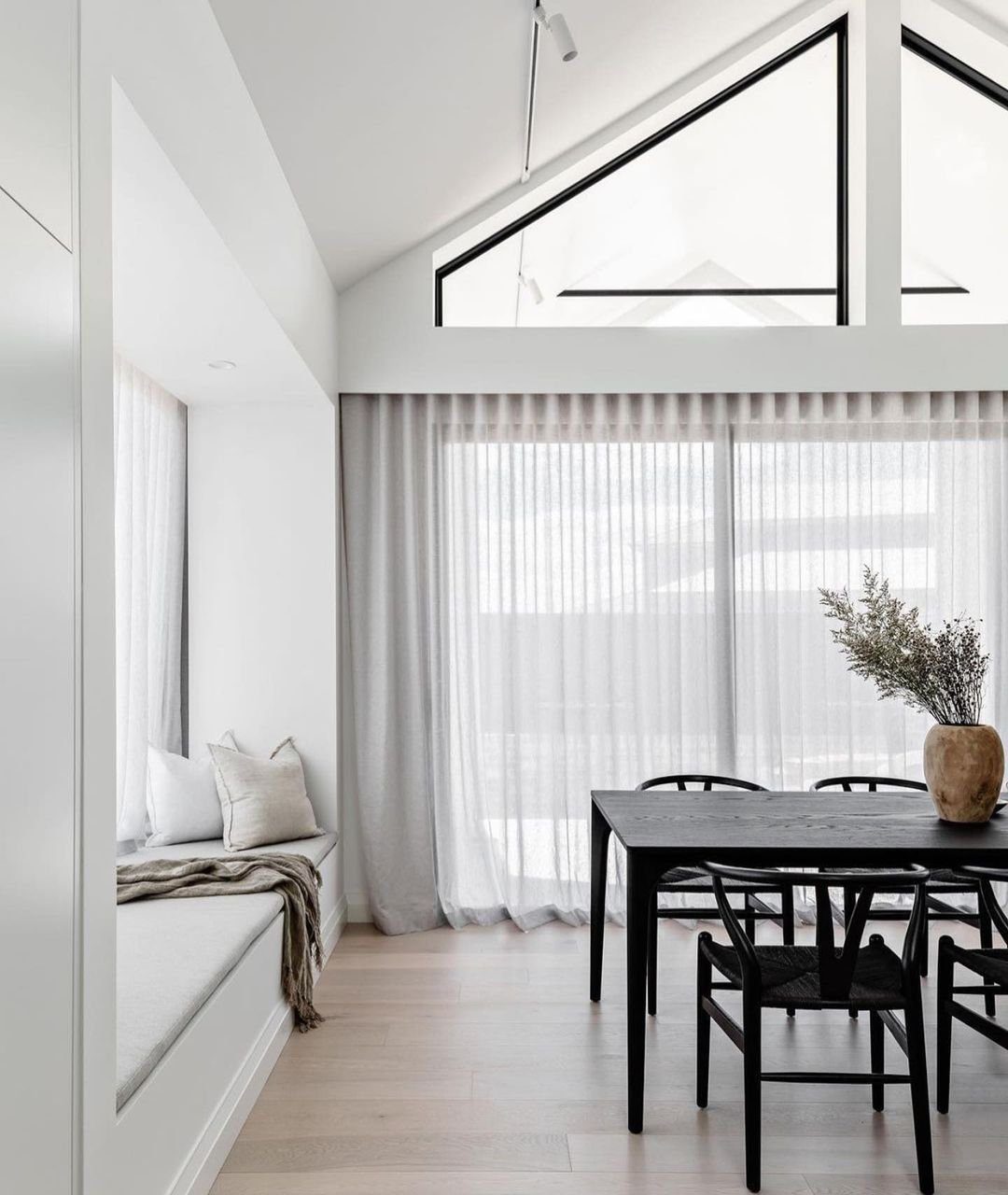 30 Jaw-Dropping Cathedral Ceiling Designs for 2025 9 Modern Cathedral Ceiling in a Chic Dining Area