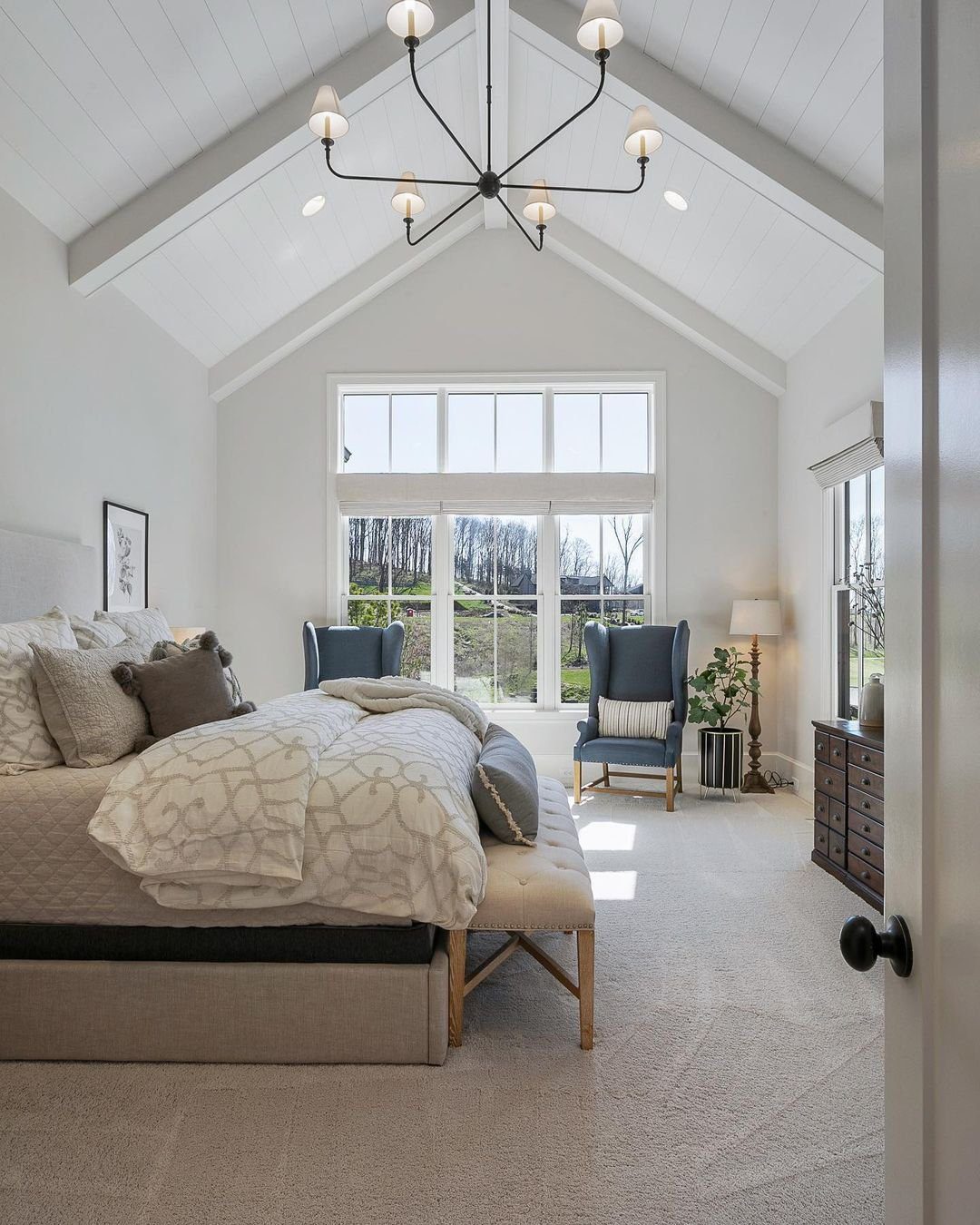 30 Jaw-Dropping Cathedral Ceiling Designs for 2025 11 Bright and Airy Bedroom with Cathedral Ceiling