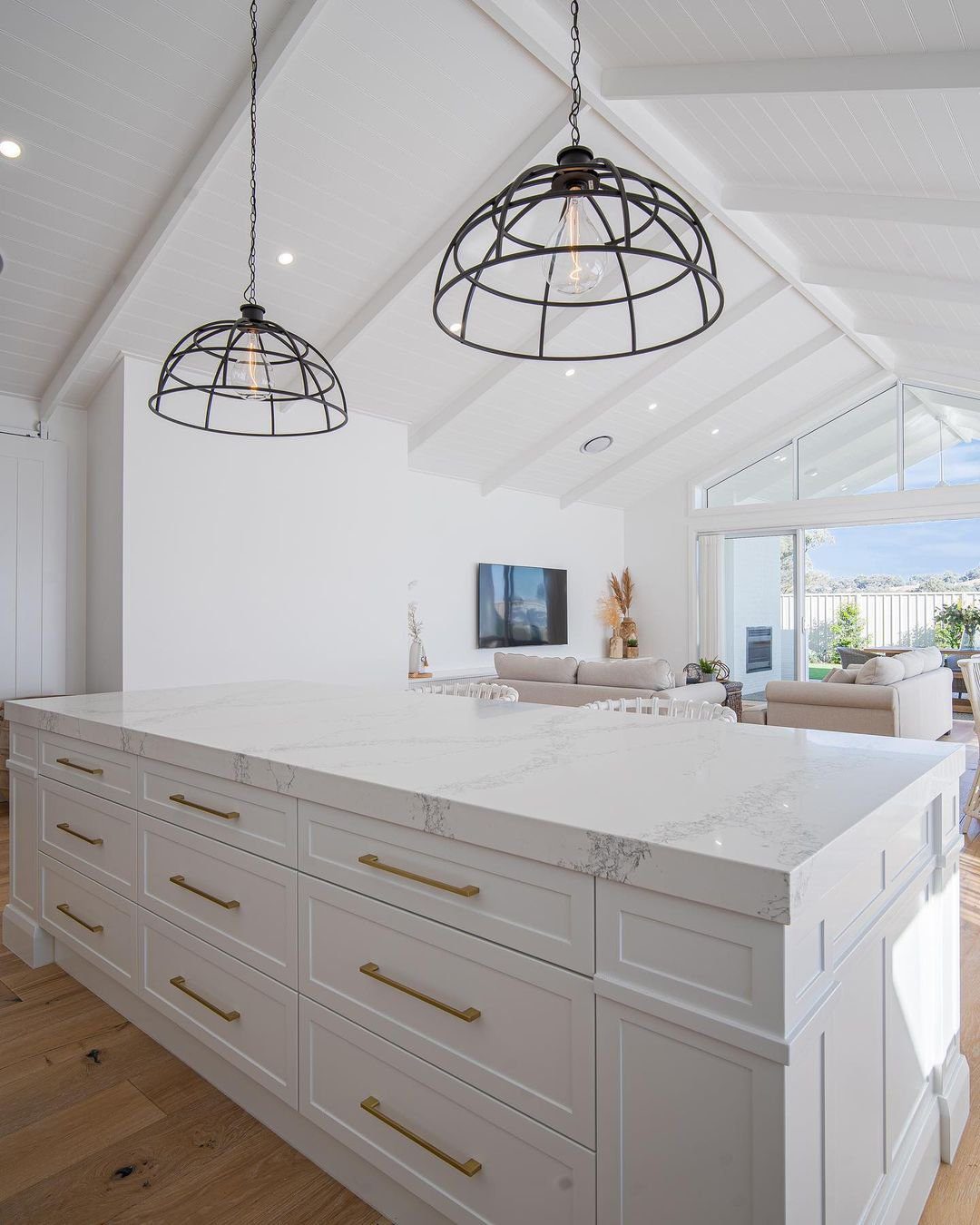 30 Jaw-Dropping Cathedral Ceiling Designs for 2025 21 21. Contemporary Kitchen with Elevated Cathedral Ceiling