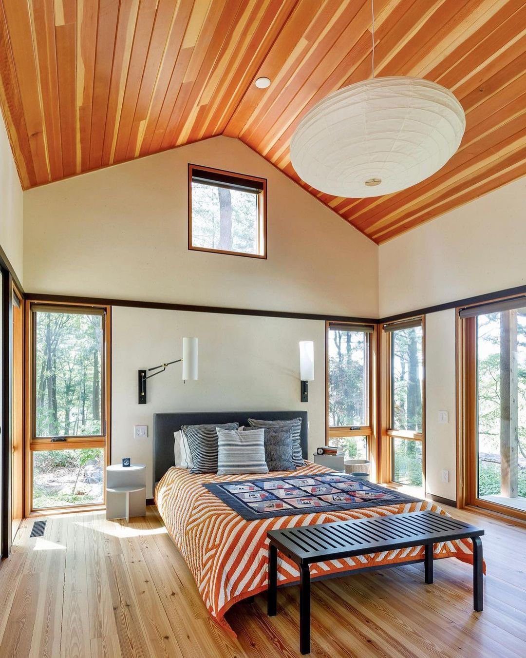 30 Jaw-Dropping Cathedral Ceiling Designs for 2025 24 Warm Wooden Cathedral Ceiling in a Modern Bedroom
