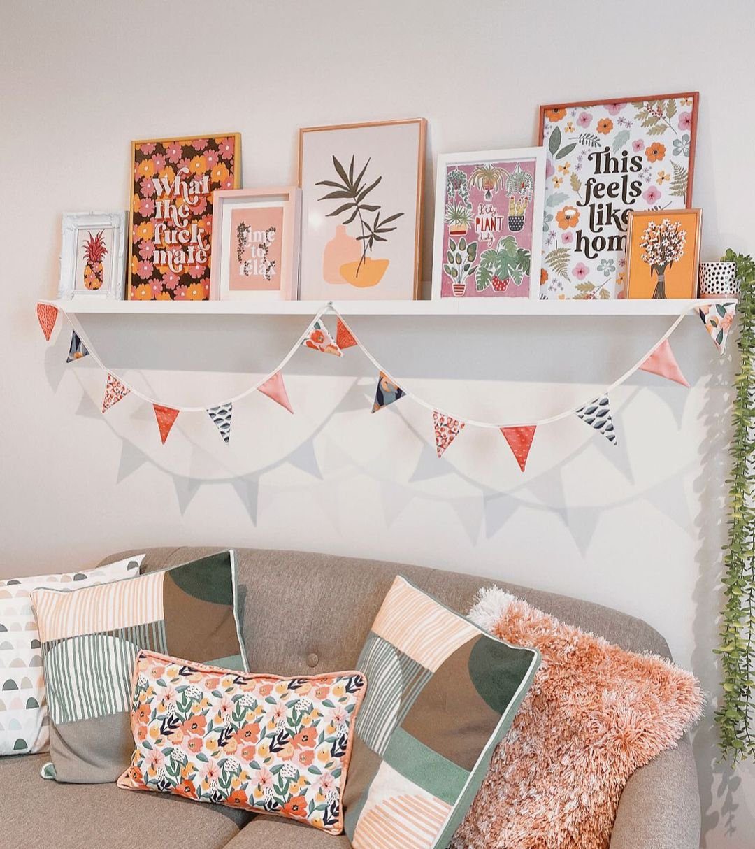 Stunning Picture Ledge Ideas That Wow in 2025! 9 Colorful Living Room with Playful Picture Ledge and Bunting