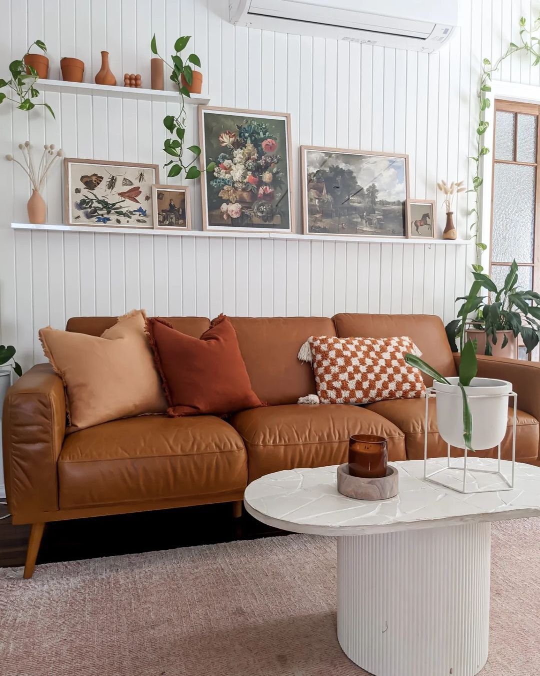 Stunning Picture Ledge Ideas That Wow in 2025! 11 Eclectic Living Room with Art-Filled Picture Ledge Display