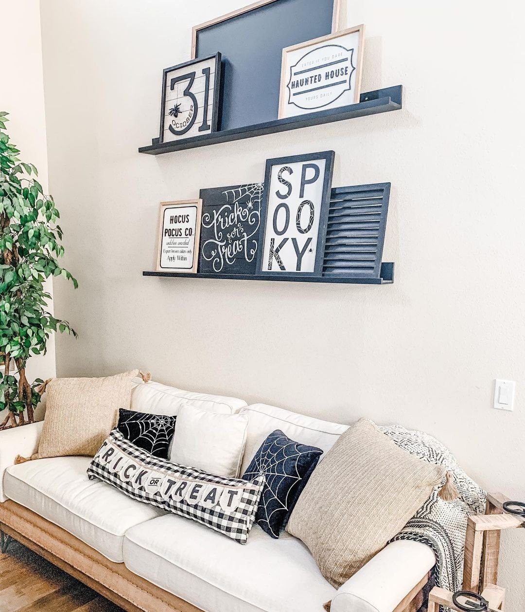 Stunning Picture Ledge Ideas That Wow in 2025! 18 Halloween-Themed Living Room with Festive Picture Ledge Display
