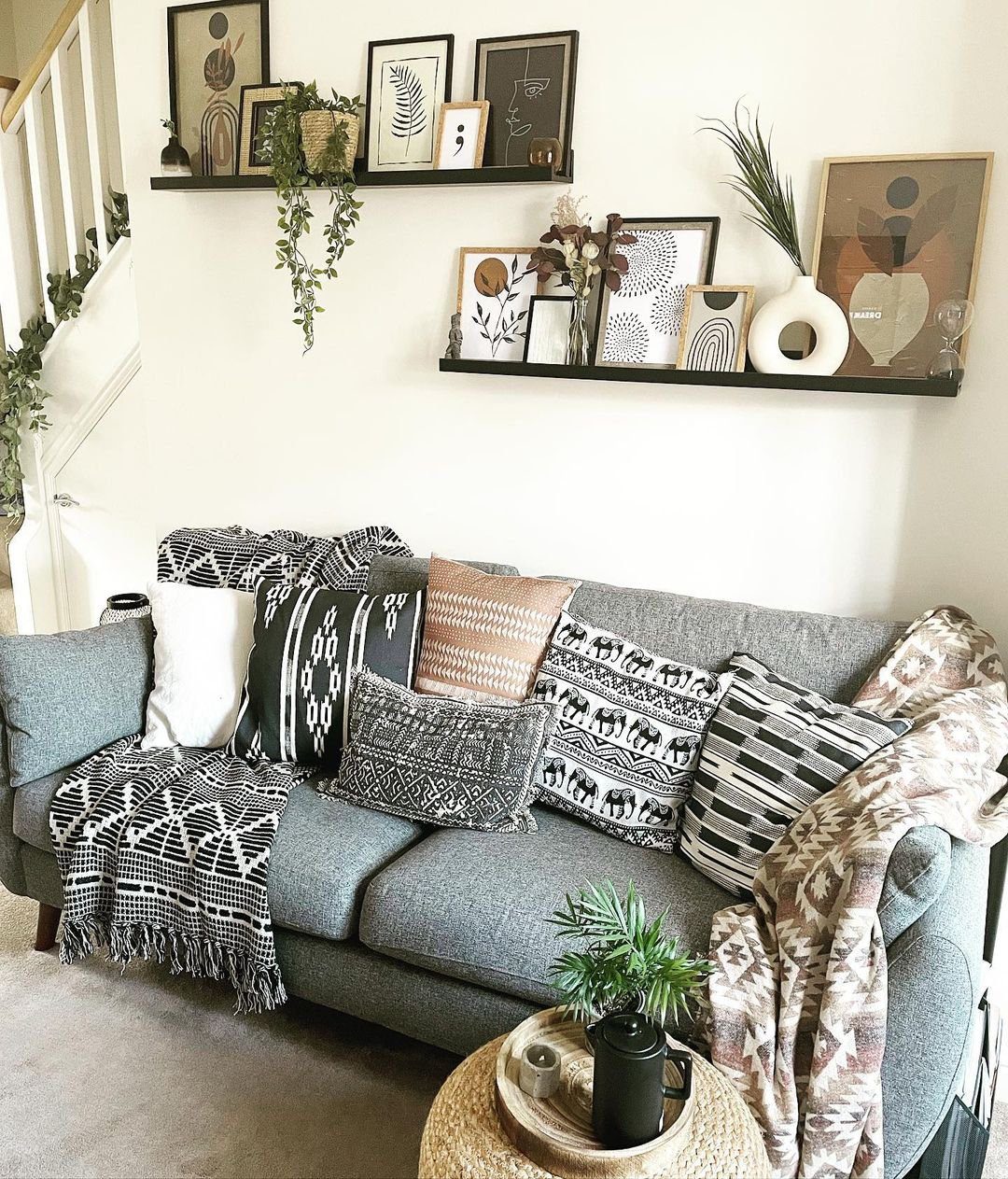 Stunning Picture Ledge Ideas That Wow in 2025! 21 Boho-Chic Living Room with Artistic Picture Ledge Display