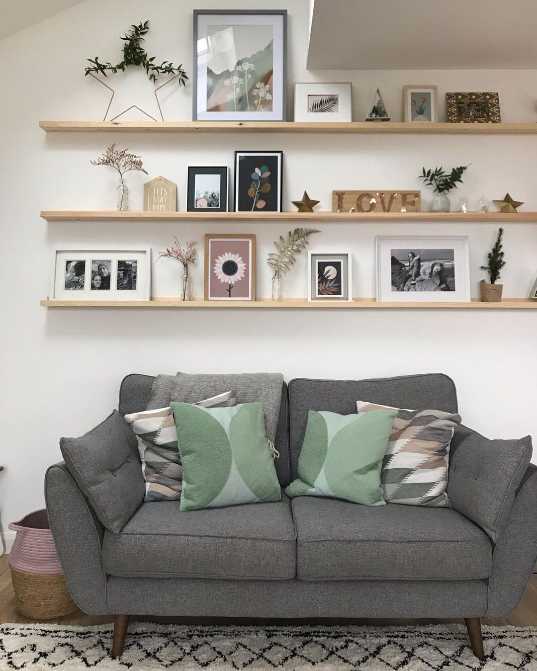 Stunning Picture Ledge Ideas That Wow in 2025! 22 Scandinavian-Inspired Living Room with Layered Picture Ledge Display