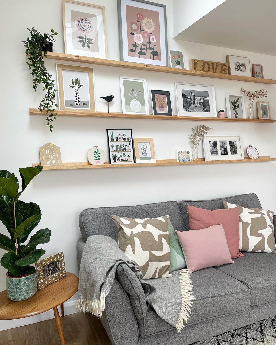 Stunning Picture Ledge Ideas That Wow in 2025! 8 Bright Living Room with Layered Picture Ledge Display