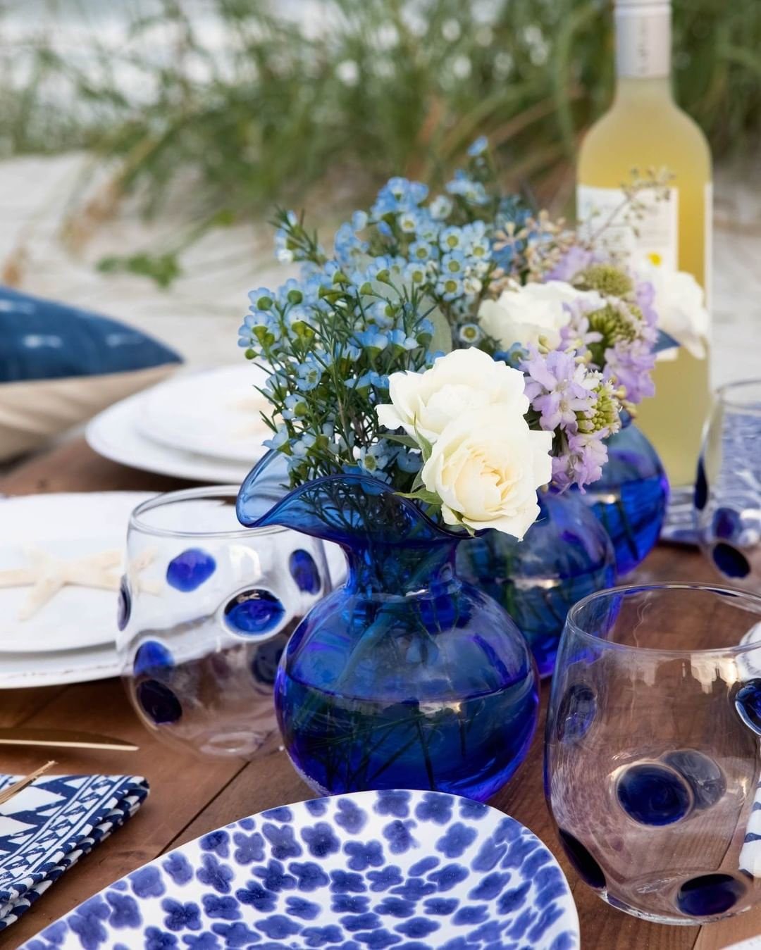 Stunning Blue Centerpieces That Will Blow Your Mind 2025 17 Rustic Blue Glass and Floral Centerpiece