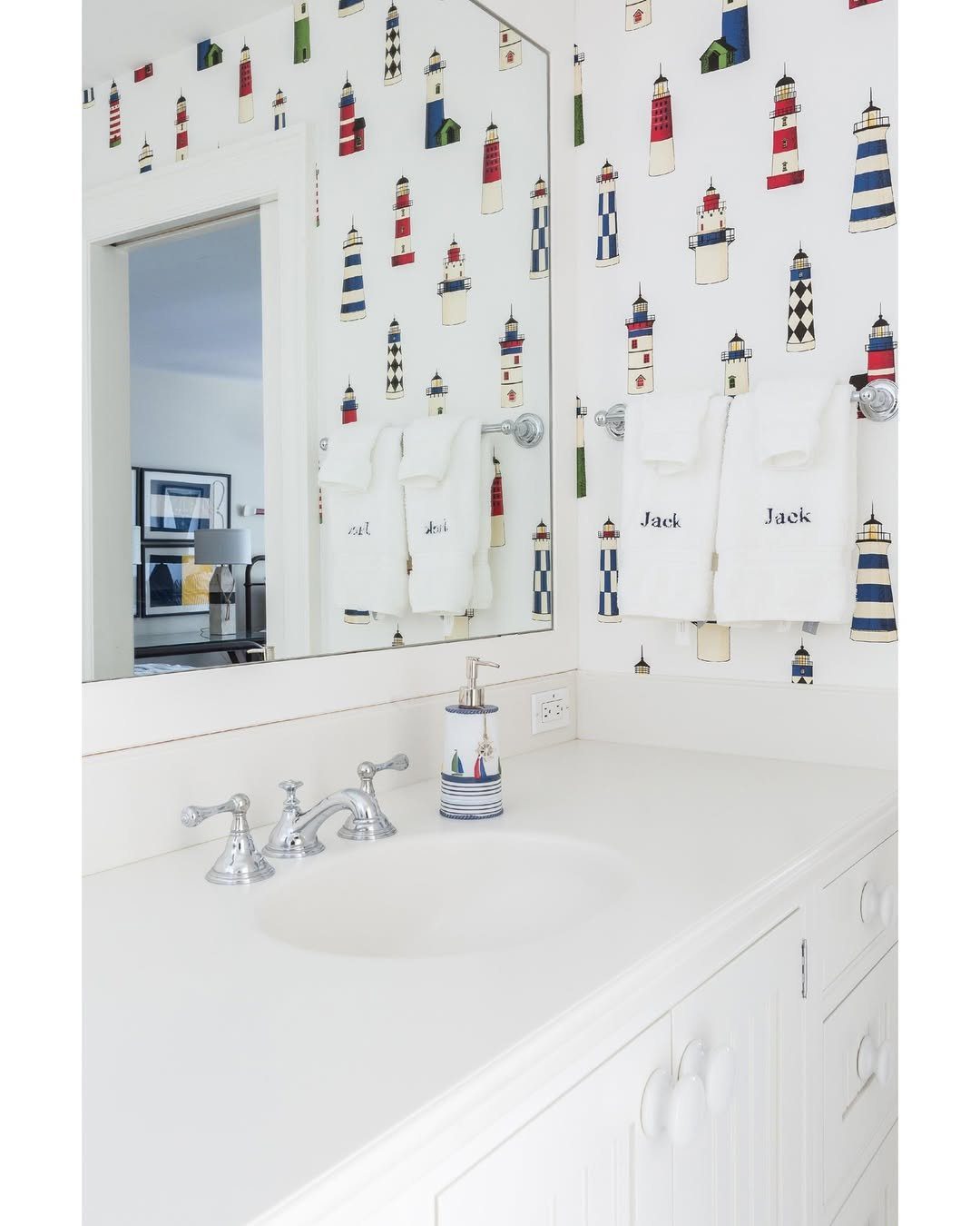 15 Dreamy Nautical Bathroom Trends for 2025 10 Whimsical Lighthouse Accents In White Beach House Decor Ideas