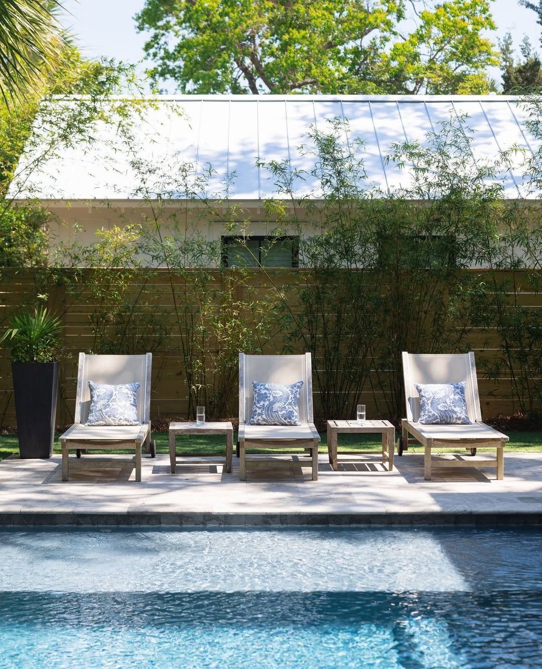 25 Jaw-Dropping Coastal Pool Decor Ideas for 2025 22 Simple Elegance With Bamboo Backdrop