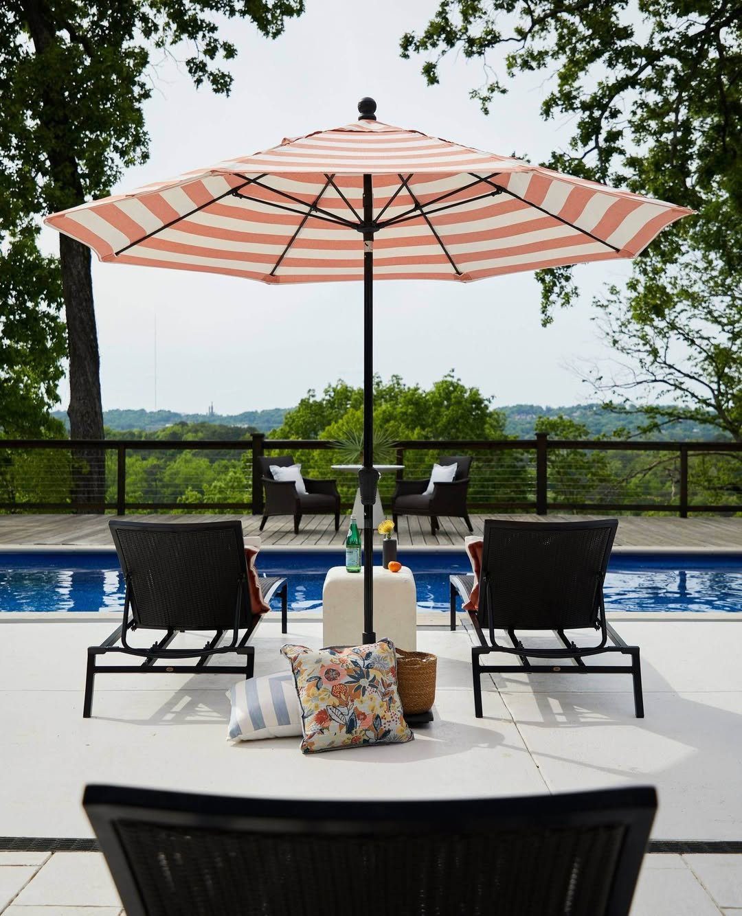 25 Jaw-Dropping Coastal Pool Decor Ideas for 2025 25 Striped Umbrella For Playful Poolside Charm