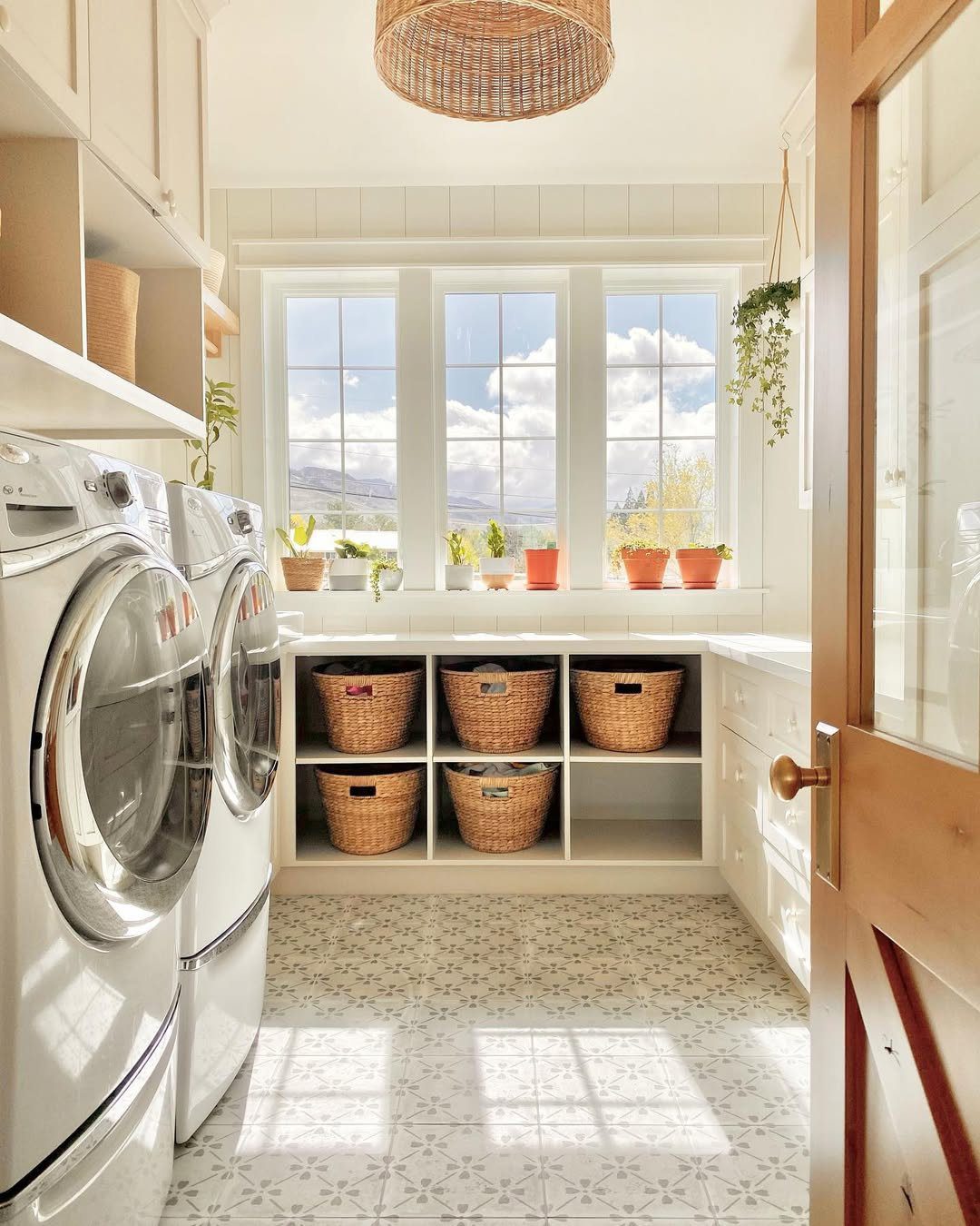 25 Dreamy Farmhouse Laundry Rooms for 2025 1 Rustic Charm Meets Practical Storage