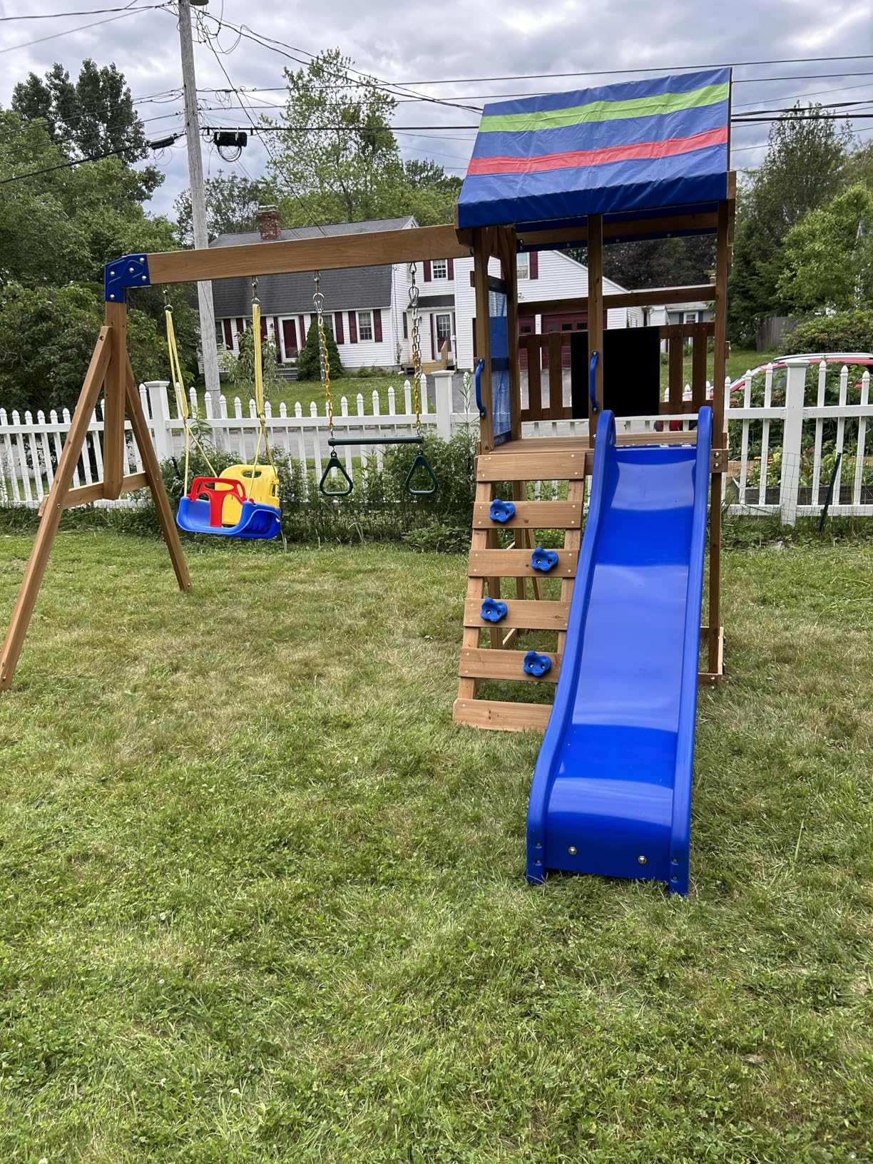 Backyard Discovery Buckley Hill Cedar Wood Swing Set with Wave Slide, Play Deck, Rock Wall Ladder, Belt Swings, Chalkboard, Canopy Roof, Outdoor Playset Customer Review Backyard Discovery Buckley Hill Cedar Wood Swing Set with Wave Slide, Play Deck, Rock Wall Ladder, Belt Swings, Chalkboard, Canopy Roof, Outdoor Playset - Customer Photo 2