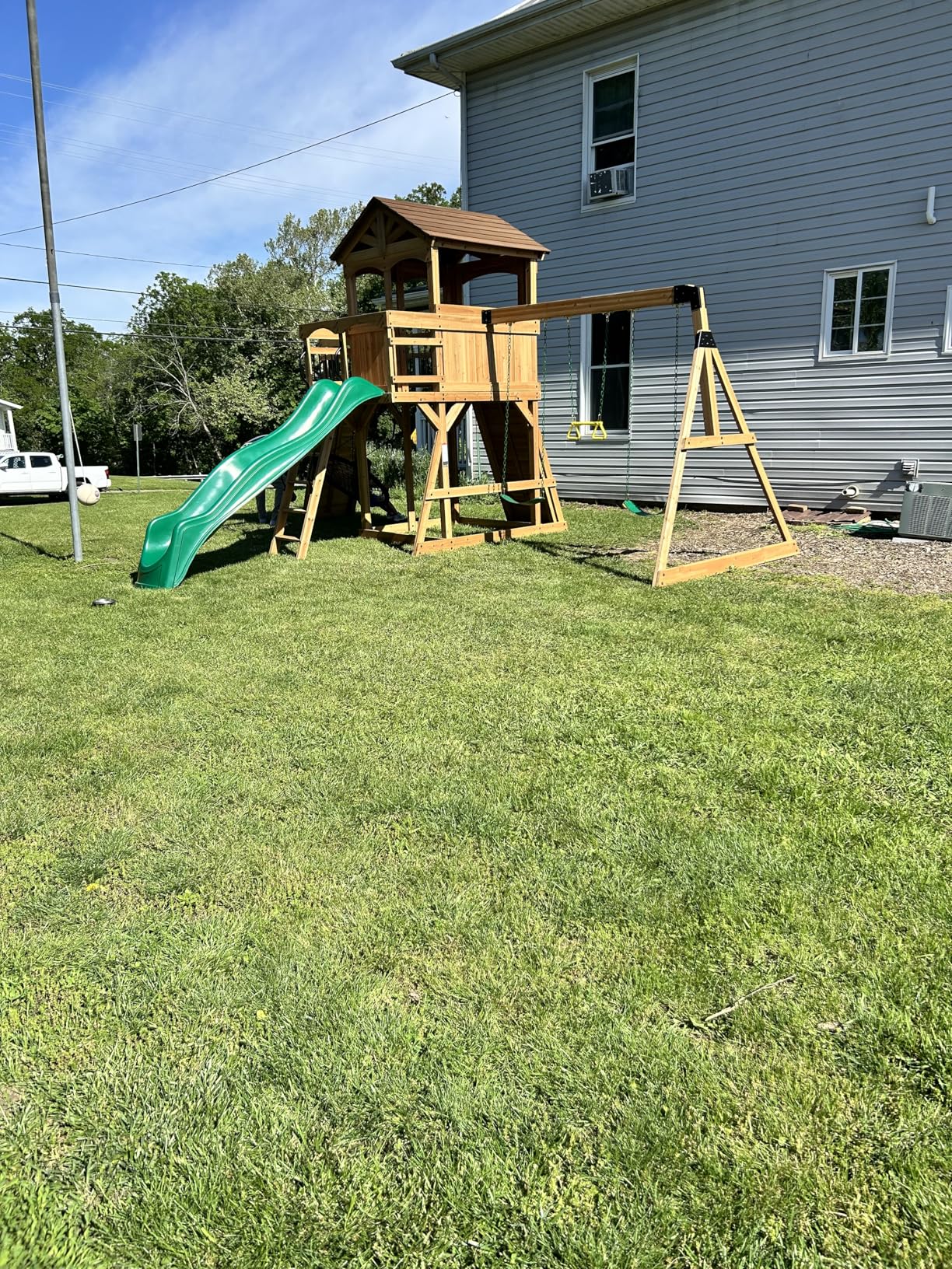 Backyard Discovery Sterling Point Cedar Wood Swing Set with Wave Slide, Raised Clubhouse, Wooden Bridge, Rock Wall, Belt Swings, Web Swing, Trapeze, Balcony, Climbing Wall, Ladder, Outdoor Playset Customer Review Backyard Discovery Sterling Point Cedar Wood Swing Set with Wave Slide, Raised Clubhouse, Wooden Bridge, Rock Wall, Belt Swings, Web Swing, Trapeze, Balcony, Climbing Wall, Ladder, Outdoor Playset - Customer Photo 1