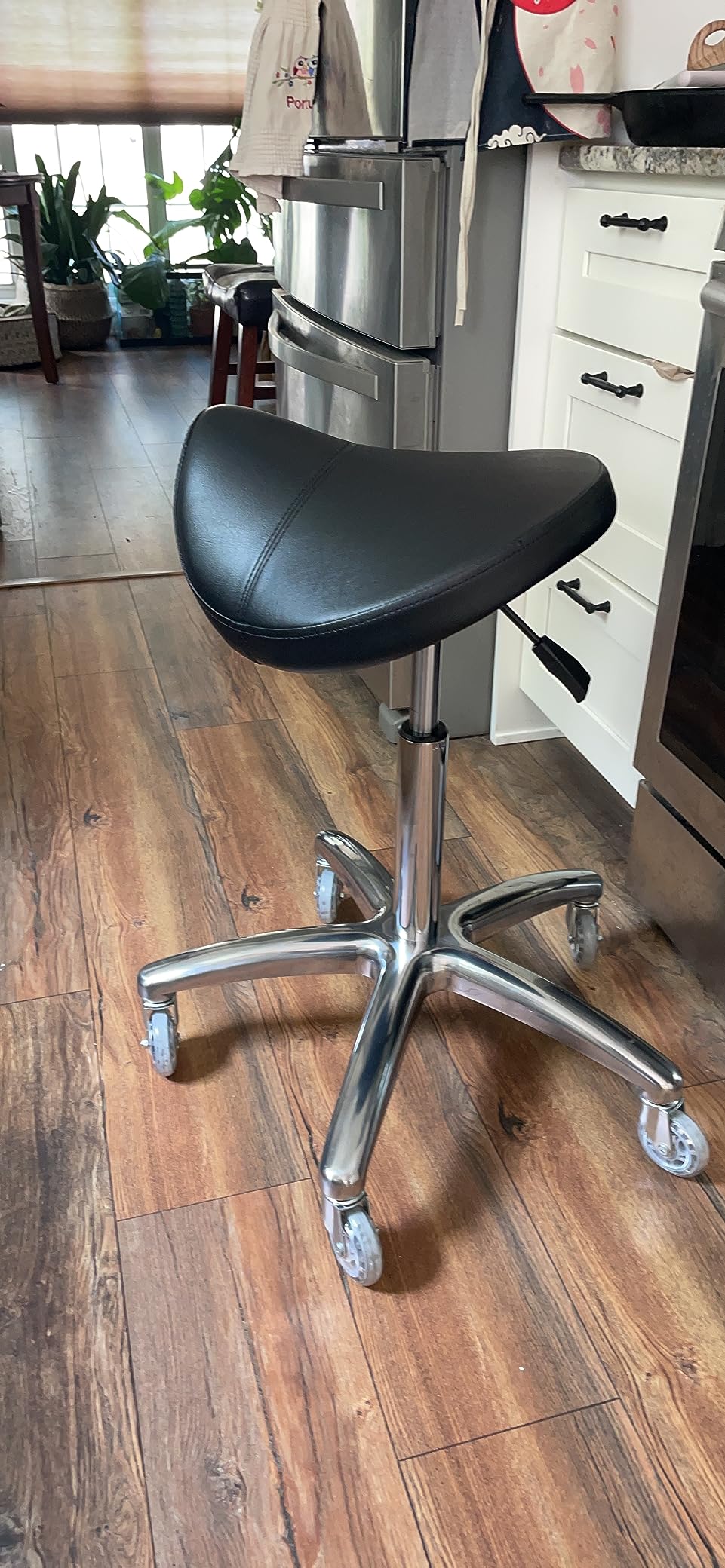 TASALON Wheeled Ergonomic Swivel Saddle Stool, Black | Comfortable rolling stool ideal for salon, spa, tattoo, massage, pedicure and kitchen use customer photo 2
